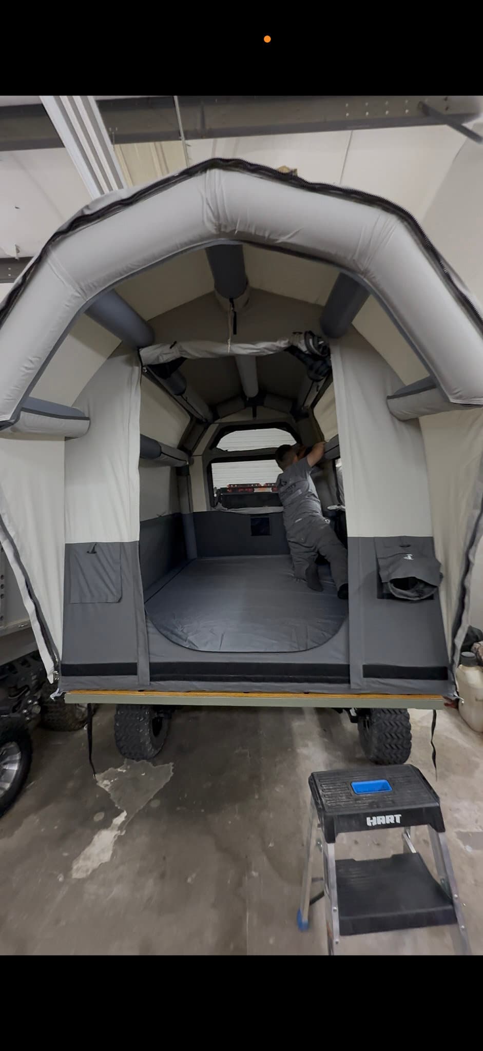 Inside the Conestoga Camper — full-height arched cabin