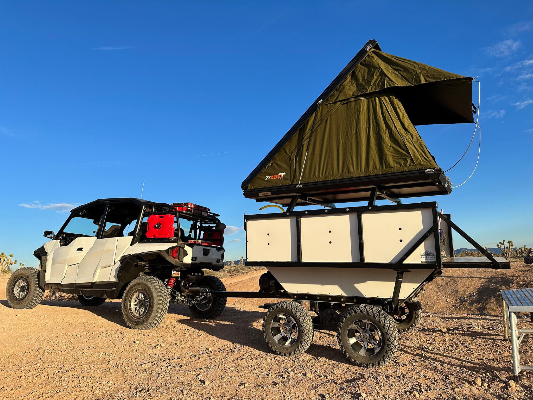 Camp Mansion hard-shell rooftop tent open on a Polaris RZR build